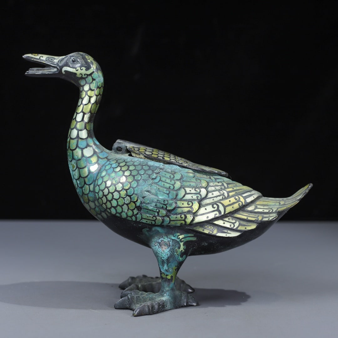 An Exquisite Bronze Inlaid Gold and Silver Duck-Shaped Censer: An Exquisite Bronze Inlaid Gold and Silver Duck-Shaped Censer the Warring States period in China Size:20cmx23cm Weight:1106g (The Dimensions Of All Batches Are Manually Measured.If You Need More Detai
