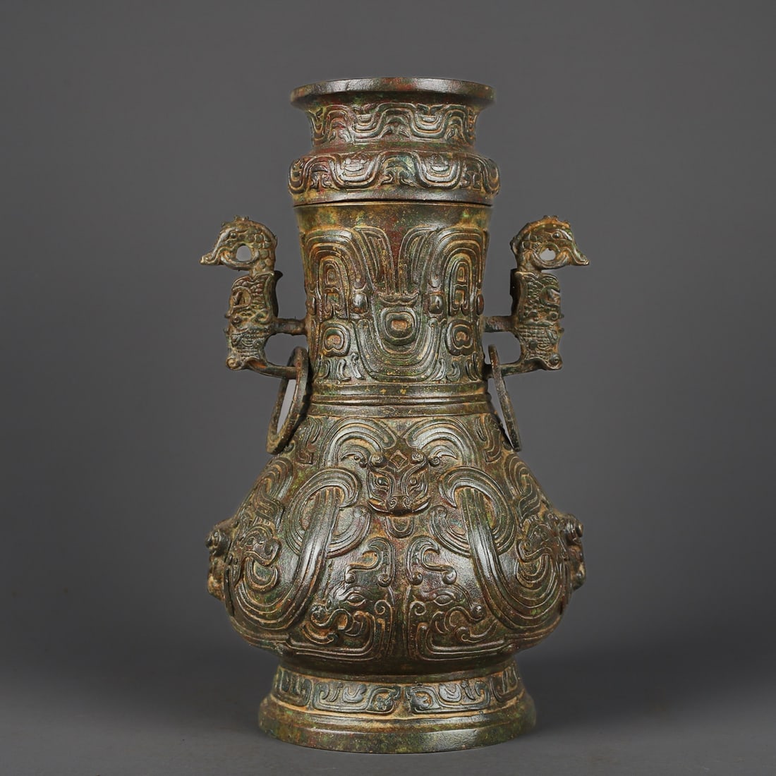 An Exquisite Bronze Dragon Pattern Beast-Face Pattern With Inscription Double-Ears Vase: An Exquisite Bronze Dragon Pattern Beast-Face Pattern With Inscription Double-Ears Vase W.Zhou , China Size:18cmx30cm Weight:4200g (The Dimensions Of All Batches Are Manually Measured.If You Need