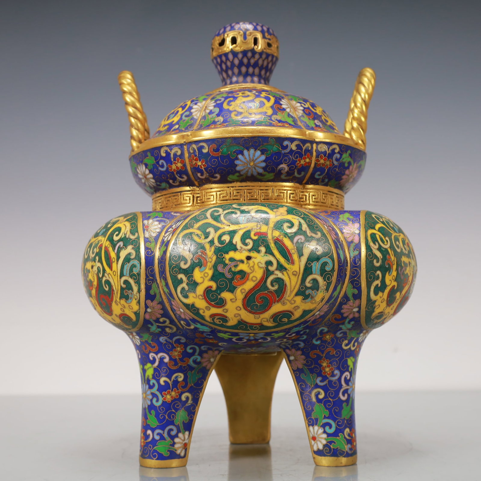 An Exquisite Cloisonne Gilt Bronze Lotus Pattern Dragon Pattern Double-Ears Tripod Censer: An Exquisite Cloisonne Gilt Bronze Lotus Pattern Dragon Pattern Double-Ears Tripod Censer Qing Dynasty, China Qianlong Four-character MarkSize:19cmx19cmx27cm Weight:5150g (The Dimensions Of All