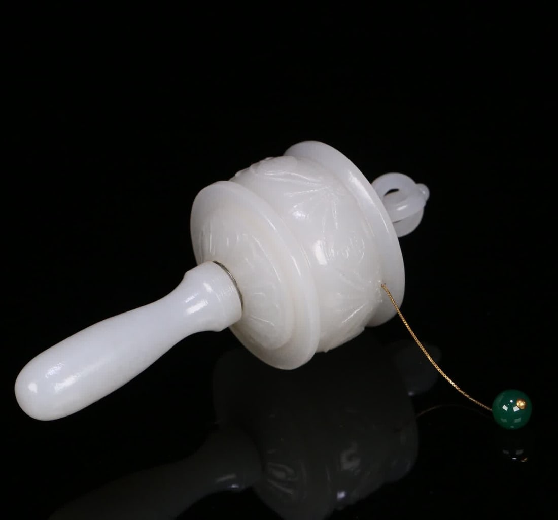 A Qing Dynasty Hetian jade canadian-style prayer wheel: Qing Dynasty Hetian jade scripture wheel SIZE: 13.5x5.4cm W:193g (The Dimensions Of All Batches Are Manually Measured.If You Need More Detailed Information, Please Contact Our Customer Service Before 