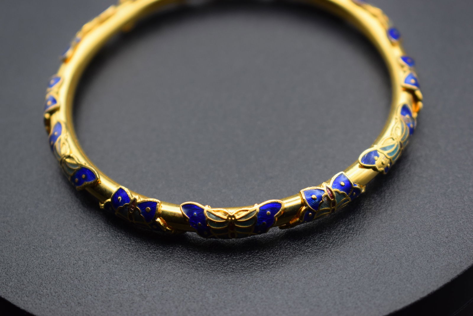 Cloisonne Gold Butterfly Bangle Bracelet Lot 326: Cloisonne Gold Butterfly Bangle Bracelet measures 2 5/8" across the inside and is 3/8" wide