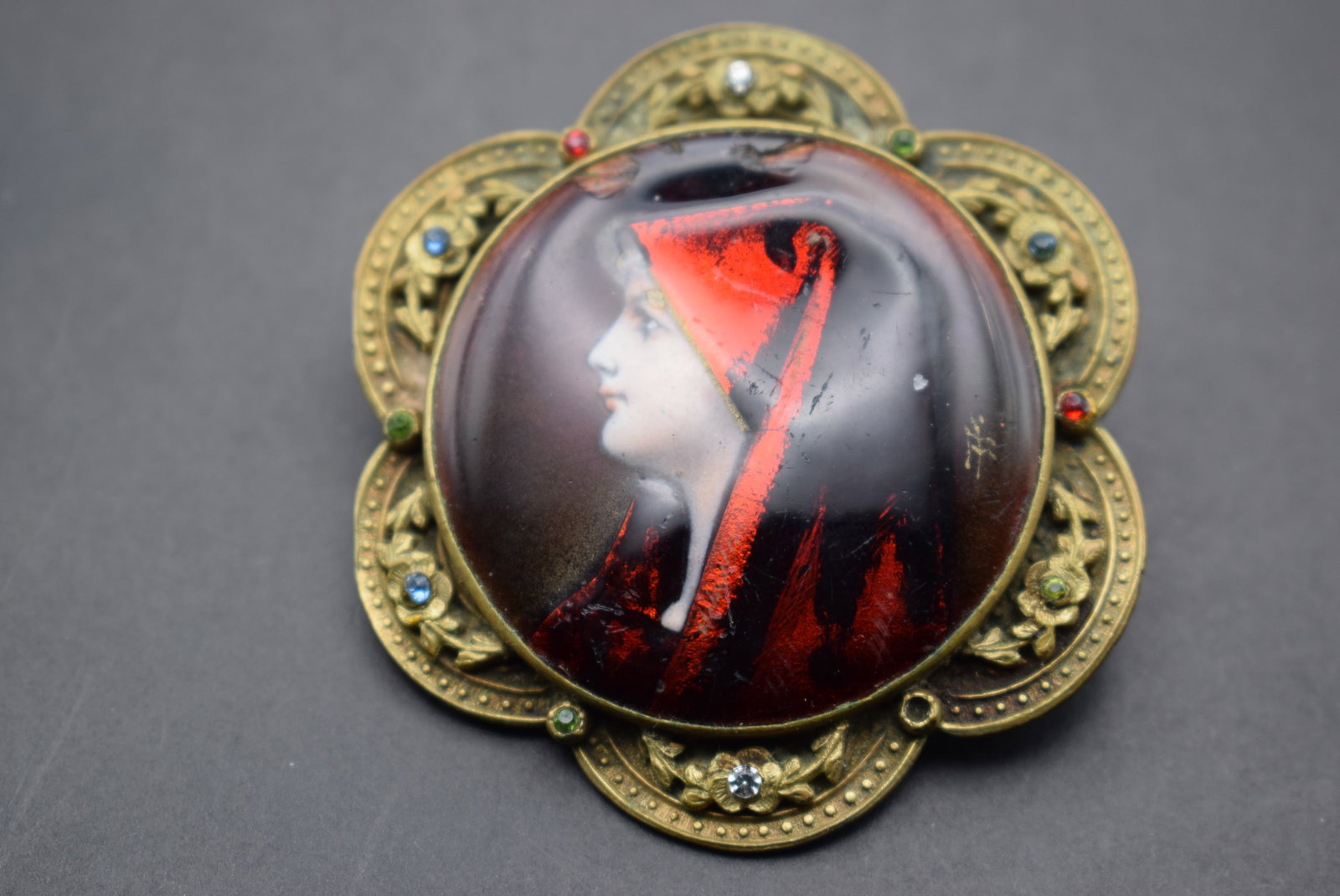 Magnificent Russian Hand Painted Enameled Cameo Brooch Lot 397: Magnificent Russian Hand Painted Enameled Cameo Brooch has two chips in the top as shown in the photos measures 2 1/4" in diameter