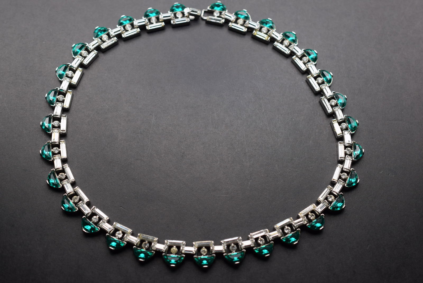 Deco Trifari Emerald Rhinestone Crown Trifari Magnificent Necklace Lot 557: Deco Trifari Emerald Rhinestone Crown Trifari Magnificent Necklace impossible to describe over the internet when you feel the weight and quality in your hands you know its quality above the rest. Meas