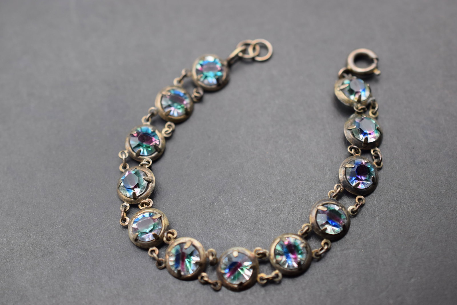 Rainbow Sterling Invisible Set Crystal Bracelet Vintage 1940's Lot 598: Rainbow Sterling Invisible Set Crystal Bracelet Vintage 1940's one link needs a repair as it has let go from the other link, measures 6 1/2" x 3/8" signed Sterling on the end ring