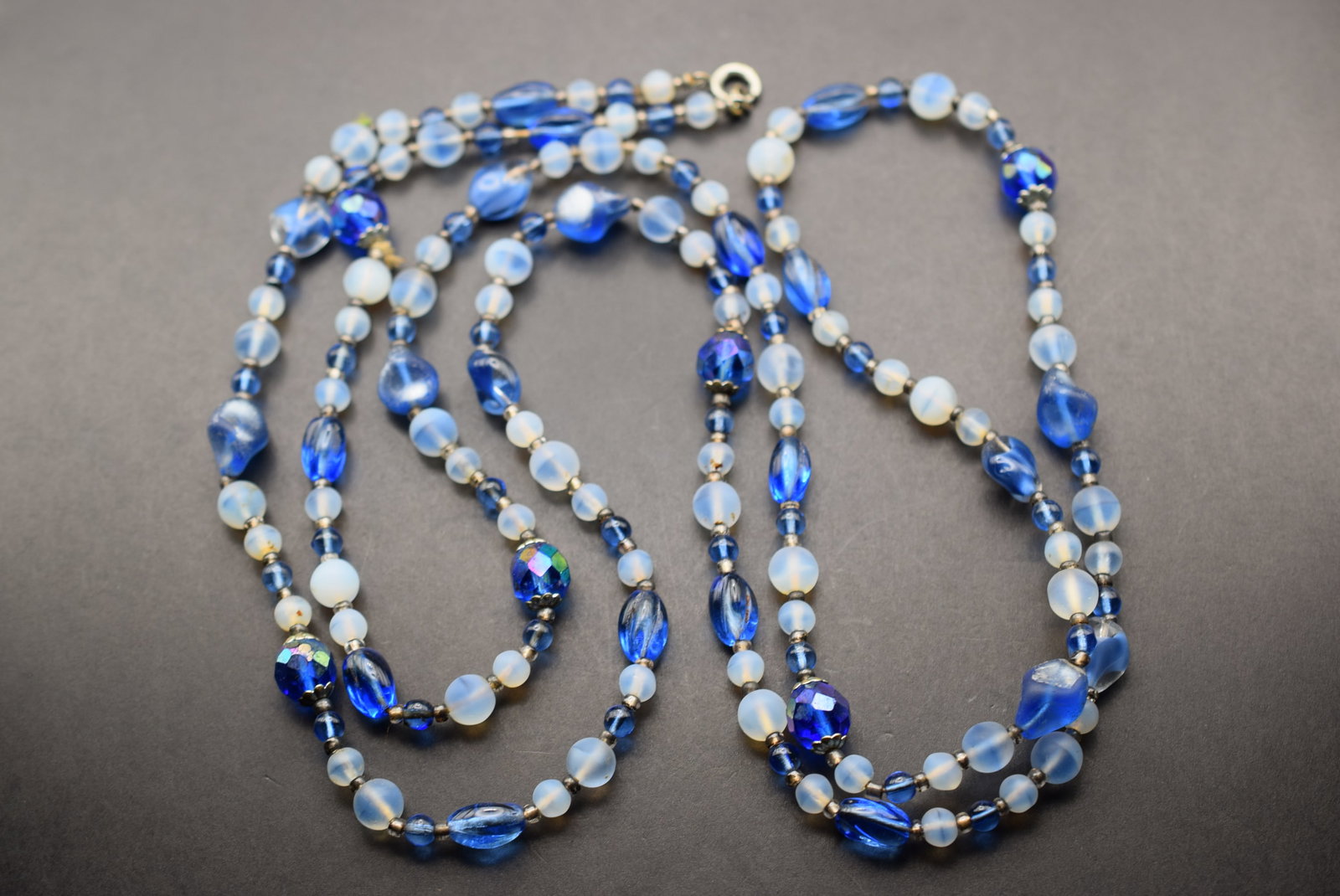 Blue Glass Vintage Necklace 50" long Lot 643: Blue Glass Vintage Necklace 50" long with a clasp all glass crystals and frosted glass beads measuring from 13mm to 4mm