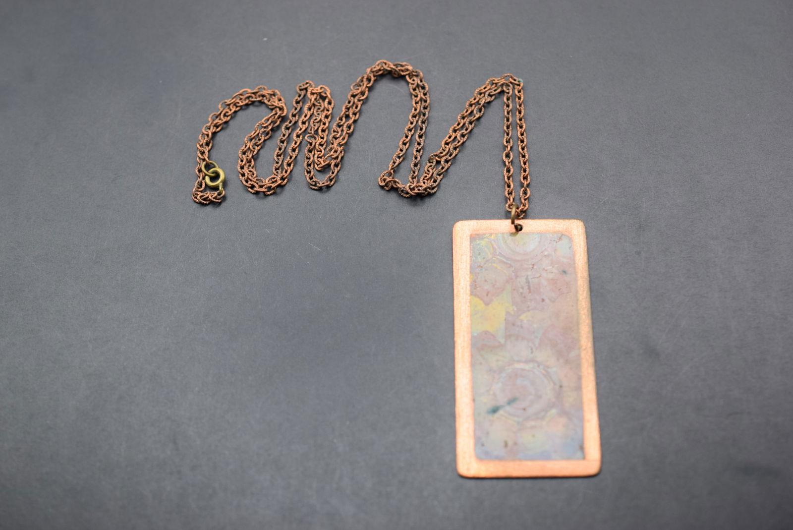 Copper Necklace healing properties Modernist Pendant Lot 837: Copper Necklace healing properties Modernist Pendant measures 2 1/2" x 1 1/4" and the chain measures 27" long