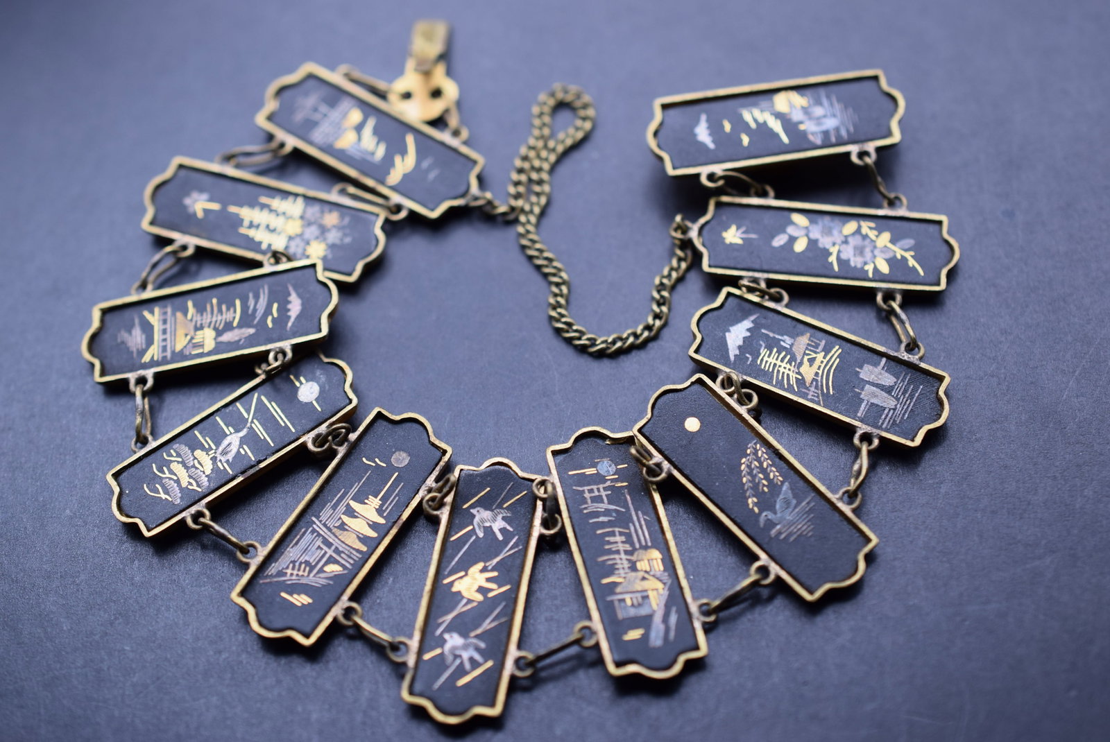 Japanese Danascene Vintage Bracelet Lot 919: Japanese Danascene Vintage Bracelet with safety chain, wear to the back, measures 8" long x 1 1/8"