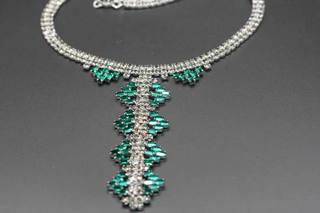 Rhinestone Baguette Green Drop Necklace vintage .lot#222: Rhinestone Baguette Green Drop Necklace vintage measures 17" long but can be worn as whort as 15" long by using the connector hook. the drop cascades down the center measuring 4" long x 1 1/8" wide
