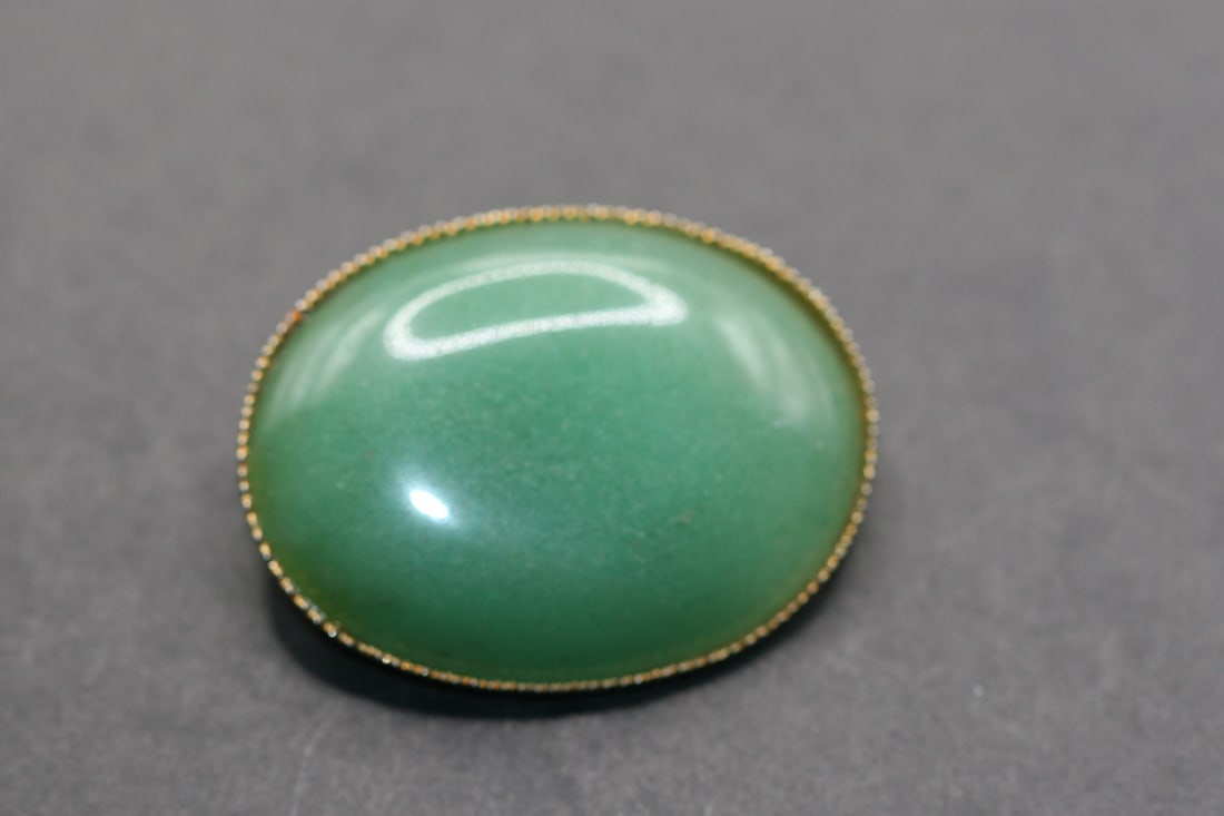 Jade Brooch Pin vintage Lot 666: Jade Brooch Pin Vintage measures 1 1/2" x 1 1/4" and has been repaired on the back as seen in photo