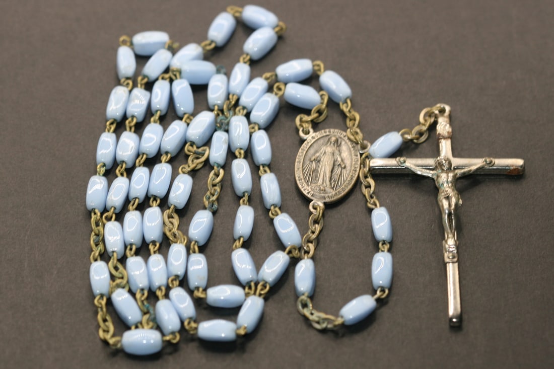Rosary Vintage Baby Blue Milk Glass Beads Lot 685: Rosary Vintage Baby Blue Milk Glass Beads measures circumference 28" drop 7 1/4" hanging length 21 1/2" some slight corrosion to the Cross see photos a well loved prayed Rosary from the 50's