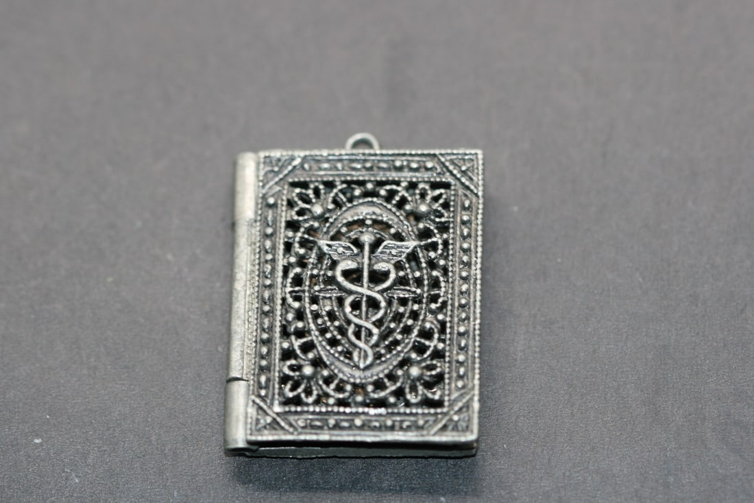 Filagree Book Medical Pendant box vintage Lot 765: Filagree Book Medical Pendant box vintage can be used to keep medical pills measures 1 1/4" x 1"