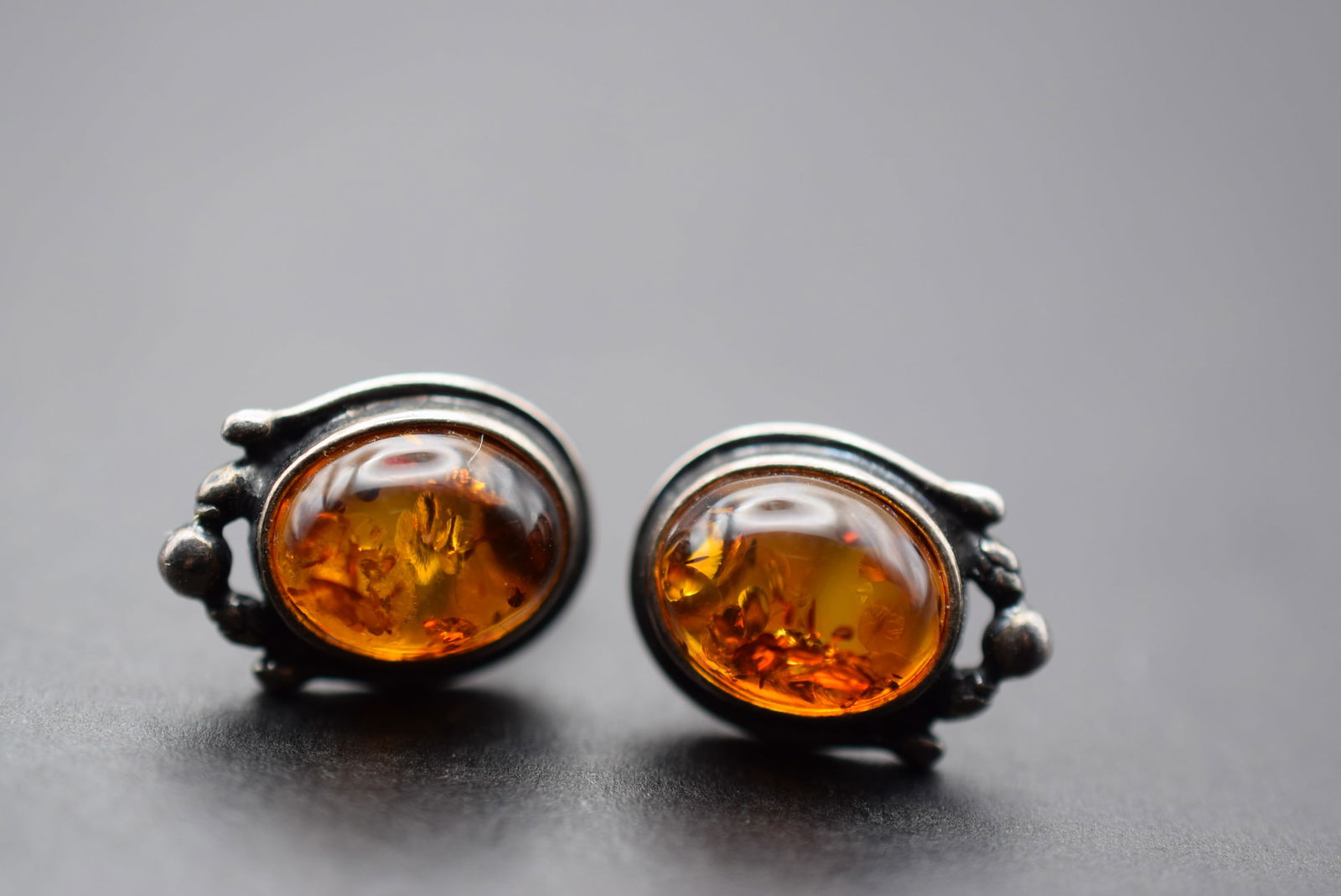 Amber Pierced Earrings Lot 11: Amber Pierced Earrings measures 5/8" x 1/2" Butterfly backing are new and are 925 Sterling Silver