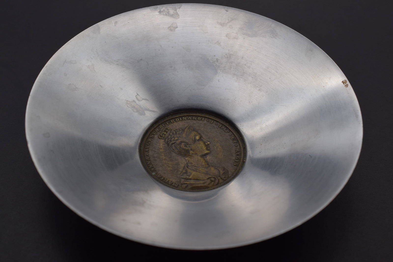 1836 Coin Maria Anna Augusta Ferdinandi I Commemorative Bronze Medallion Stainless Bowl Lot 95: 1836 Coin Maria Anna Augusta Ferdinandi I Commemorative Bronze Medallion Stainless Bowl measures 5 1/4" in diameter