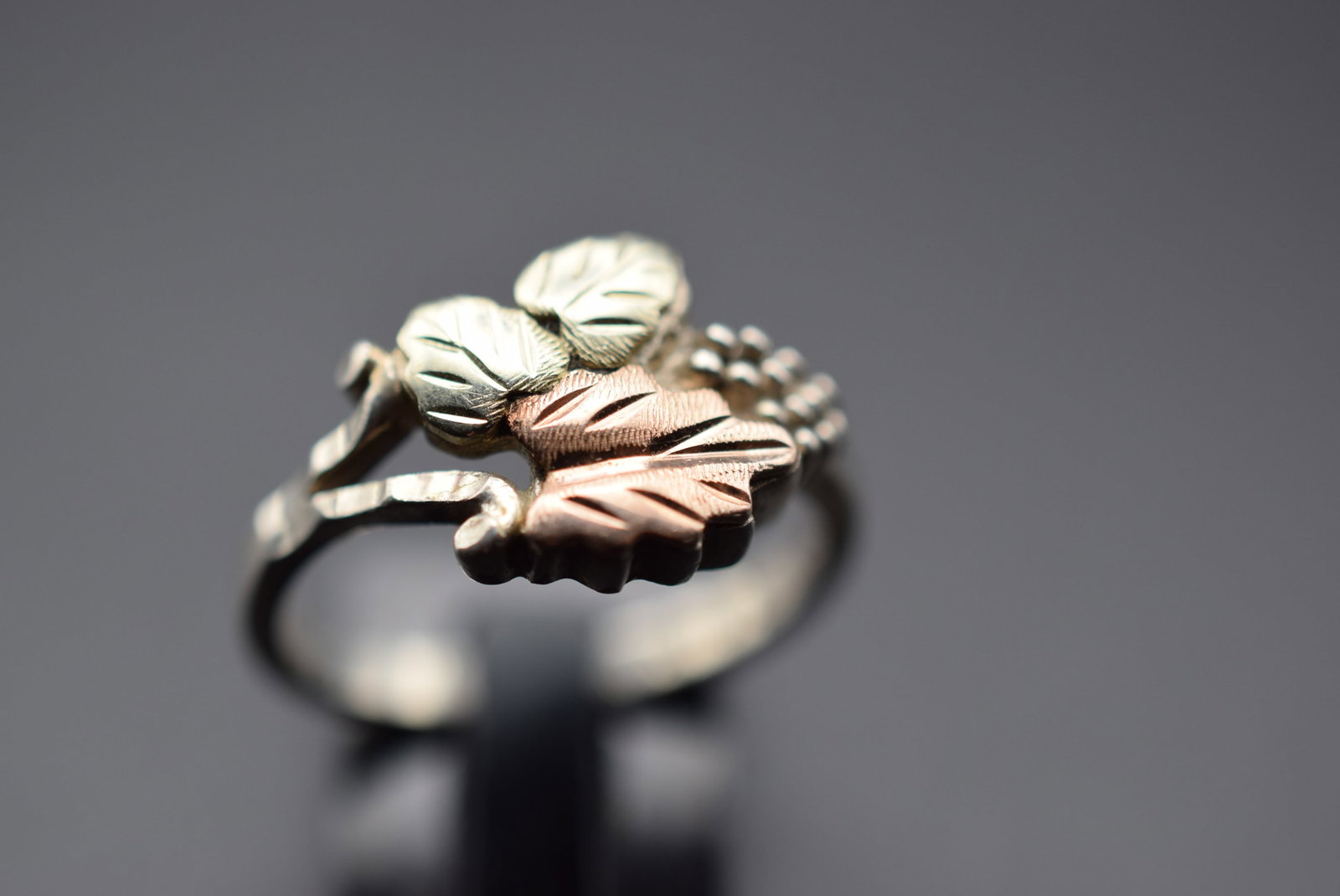10K Gold and Sterling Silver 925 Ring Size 6.5 Lot 202: 10K Gold and Sterling Silver 925 Ring Size 6.5 Weighs 3.44 grams Top measures 1/2" signed STER & 10K