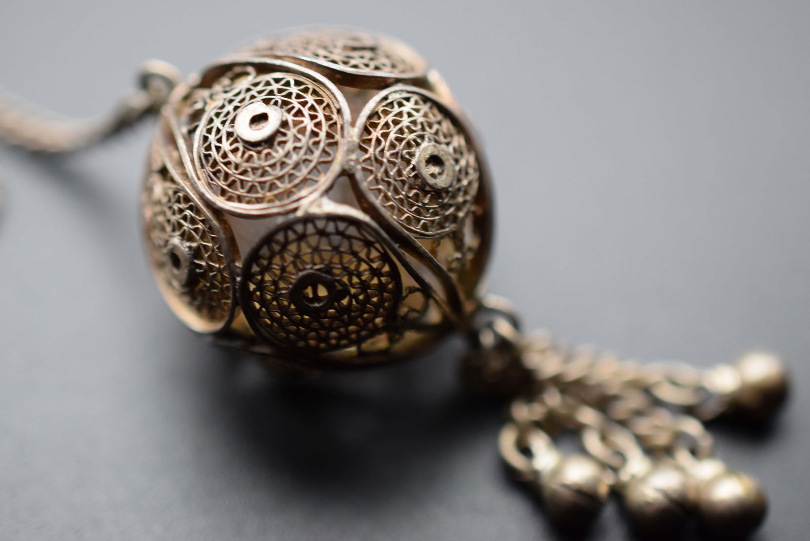 Filigree Ball Middle Eastern on long chain Lot 633: Filigree Ball Middle Eastern on long chain without clasp and has dangles hanging unsigned