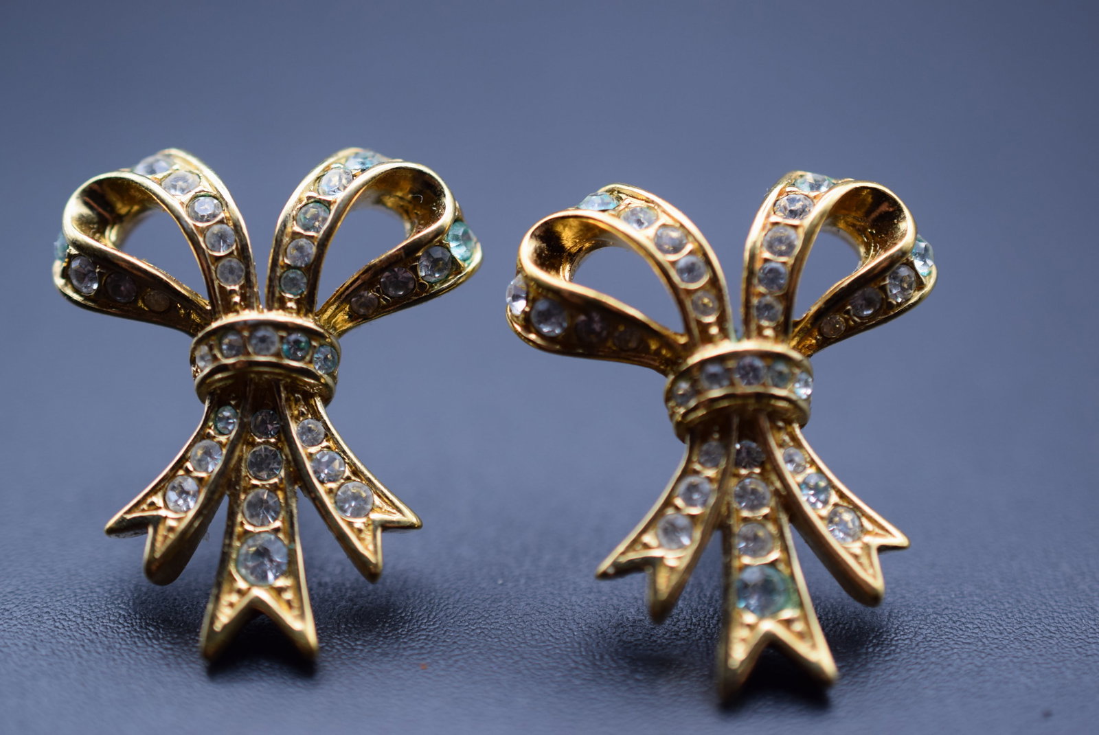 Rhinestone Gold Plated Bow Pierced Earrings Lot 644: Rhinestone Gold Plated Bow Pierced Earrings measures 1" x 7/8" signed A&S