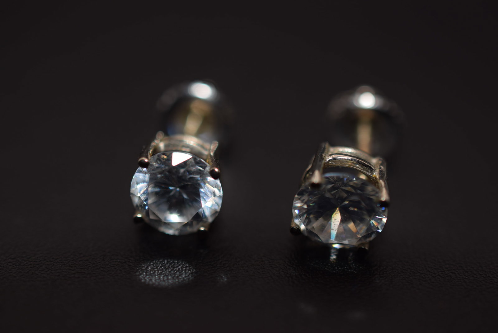 CZ Stud Pierced Earrings Lot 658: CZ Stud Pierced Earrings measures 1/4" and the butterfly backings screw/twist on