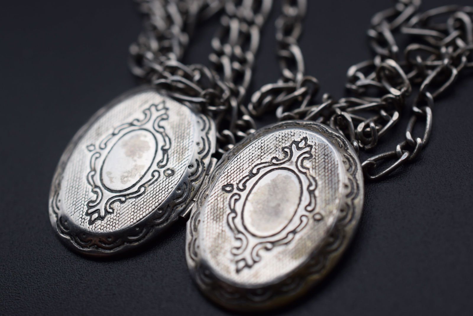 Locket Chain and charms Key Heart Double sided Locket chain measures 38" Lot 689: Locket Chain and charms Key Heart Double sided Locket chain measures 38" Long locket measures 1 1/4" x 1" not Sterling