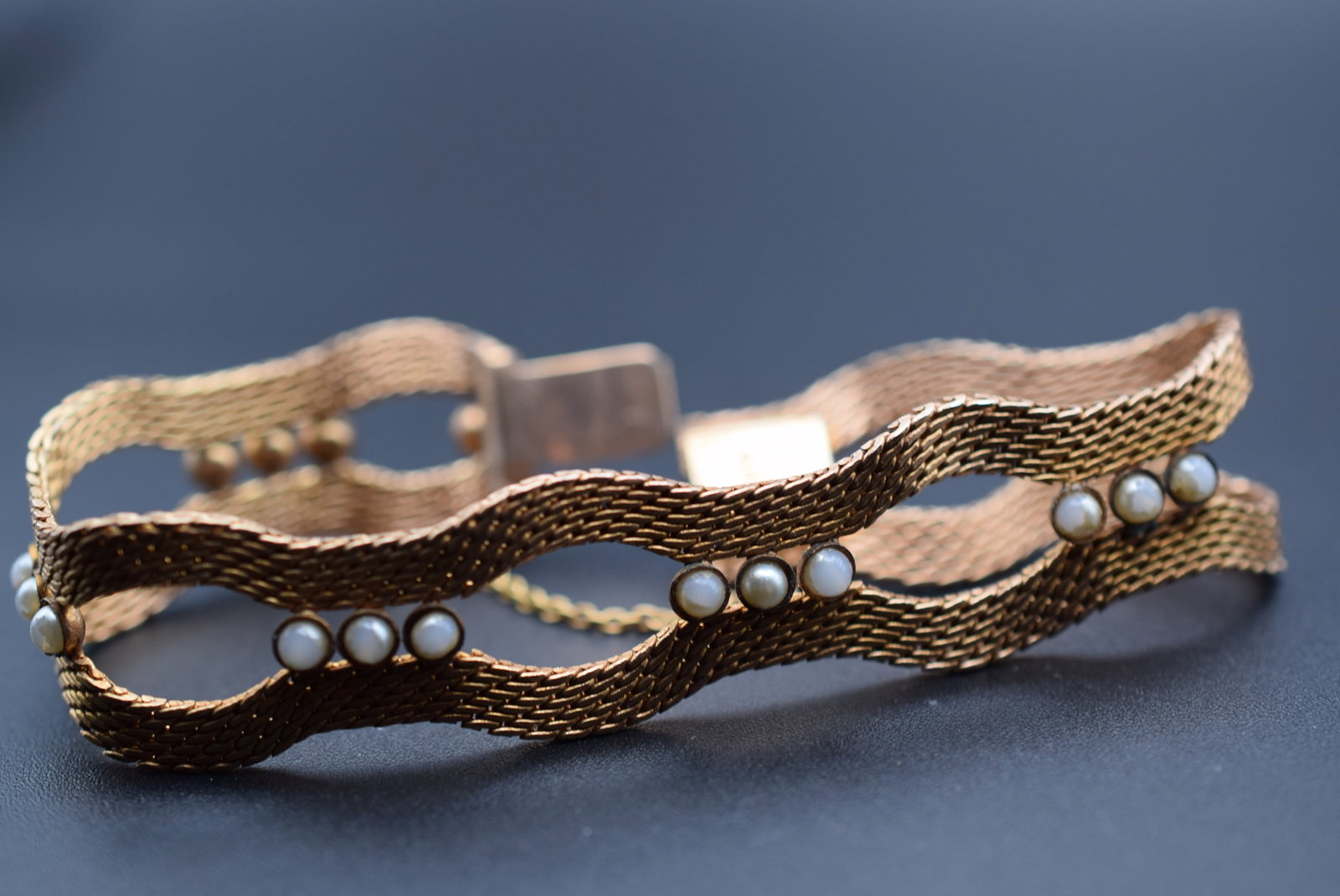 Radi Vintage Bracelet Lot 738: Radi Vintage Bracelet measures 7 1/2" x 3/4" seed pearls worn , has a safety chain, signed Radi