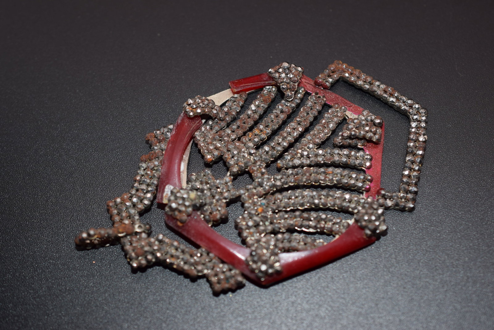 France Art Deco Pendant Vintage 1920's Cut Steel Lot 776: France Art Deco Pendant Vintage 1920's Cut Steel measures 3 1/2" x 2" has rust needs cleaning carefully one burgundy piece is broken off signed Made in France