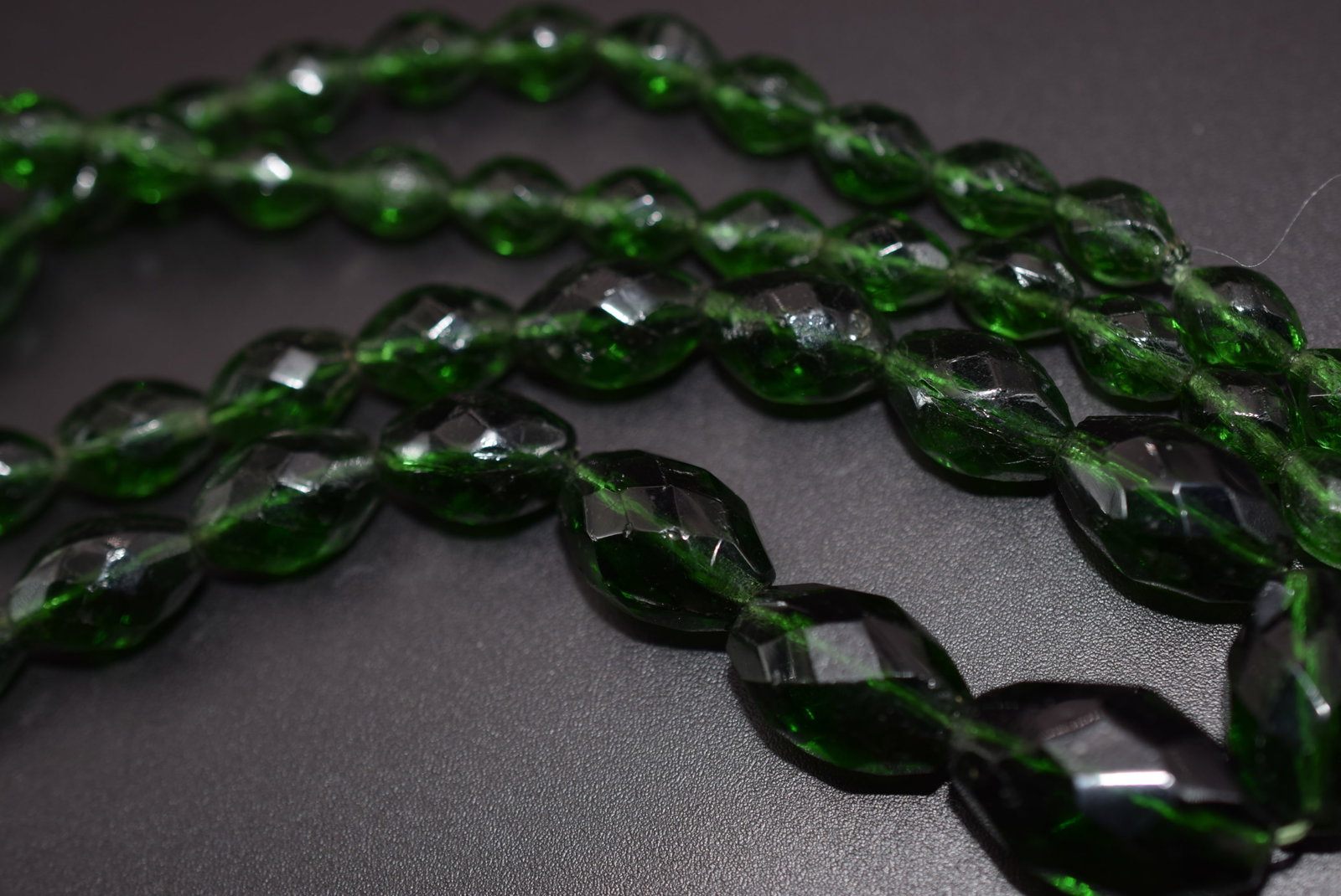 Emerald Green Glass Vintage Necklace Lot 804: Emerald Green Glass Vintage Necklace measures 24" Long center has a chip in it with the deep color it is difficult to notice as it is on the back