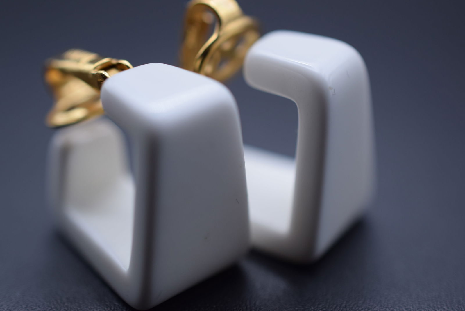 Trifari 1960's White Plastics Resin GOGO Clip Signed Earrings Lot 869: Trifari 1960's White Plastics Resin GOGO Clip Signed Earrings measures 3/4" x 3/4" x 1/2" wide signed Crown Over T Trifari