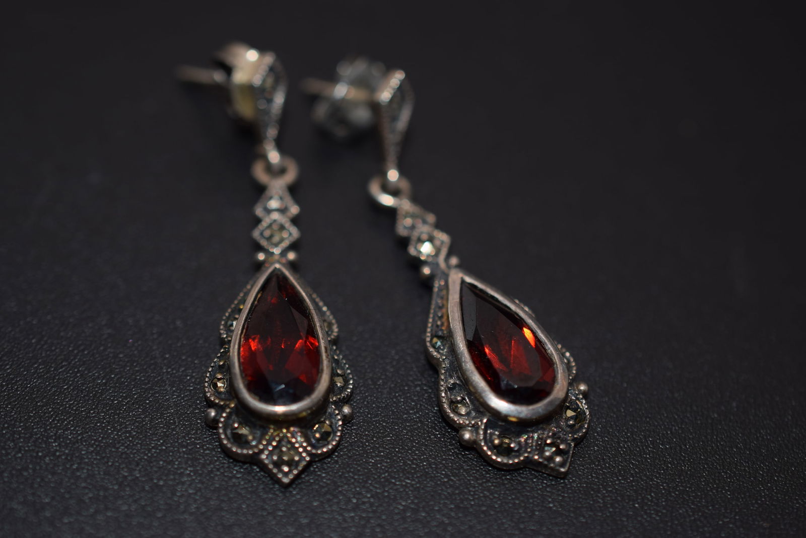 Marcasite Sterling Garnet Pierced Earrings Sterling Silver 925 Lot 880: Marcasite Sterling Garnet Pierced Earrings Sterling Silver 925 Weighs 4.81 grams measures 1 3/8" x 1/2" signed 925 SHA