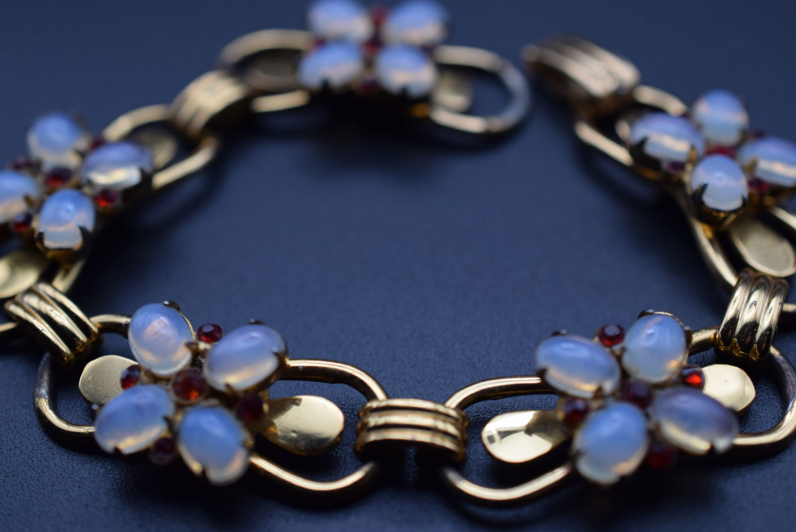 Coro Sterling Silver Vermeil Vintage 1940's Moonstone and Rhinestone Bracelet Lot 1055: Coro Sterling Silver Vermeil Vintage 1940's Moonstone and Rhinestone Bracelet measures 7 1/4" x 5/8" wide signed Sterling on the back of the clasp and Coro on the inside of the clasp