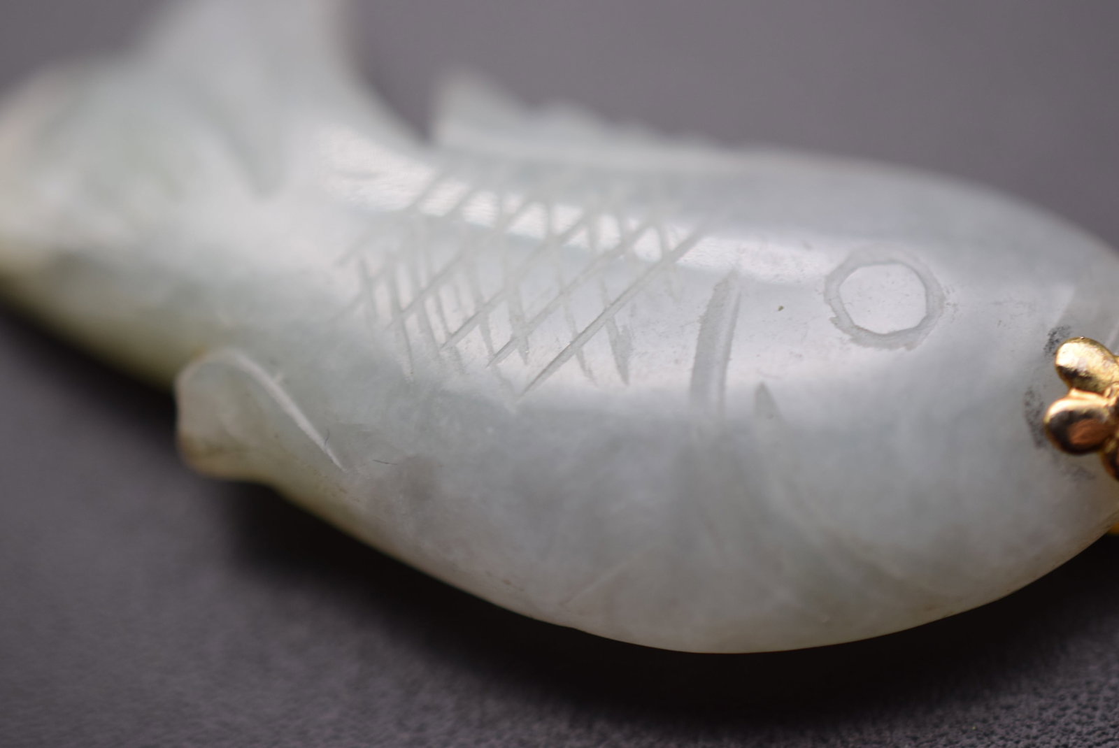 Genuine Fish Jade Carved Pendant Lot 1062: Genuine Fish Jade Carved Pendant measures 2" x 3/4"