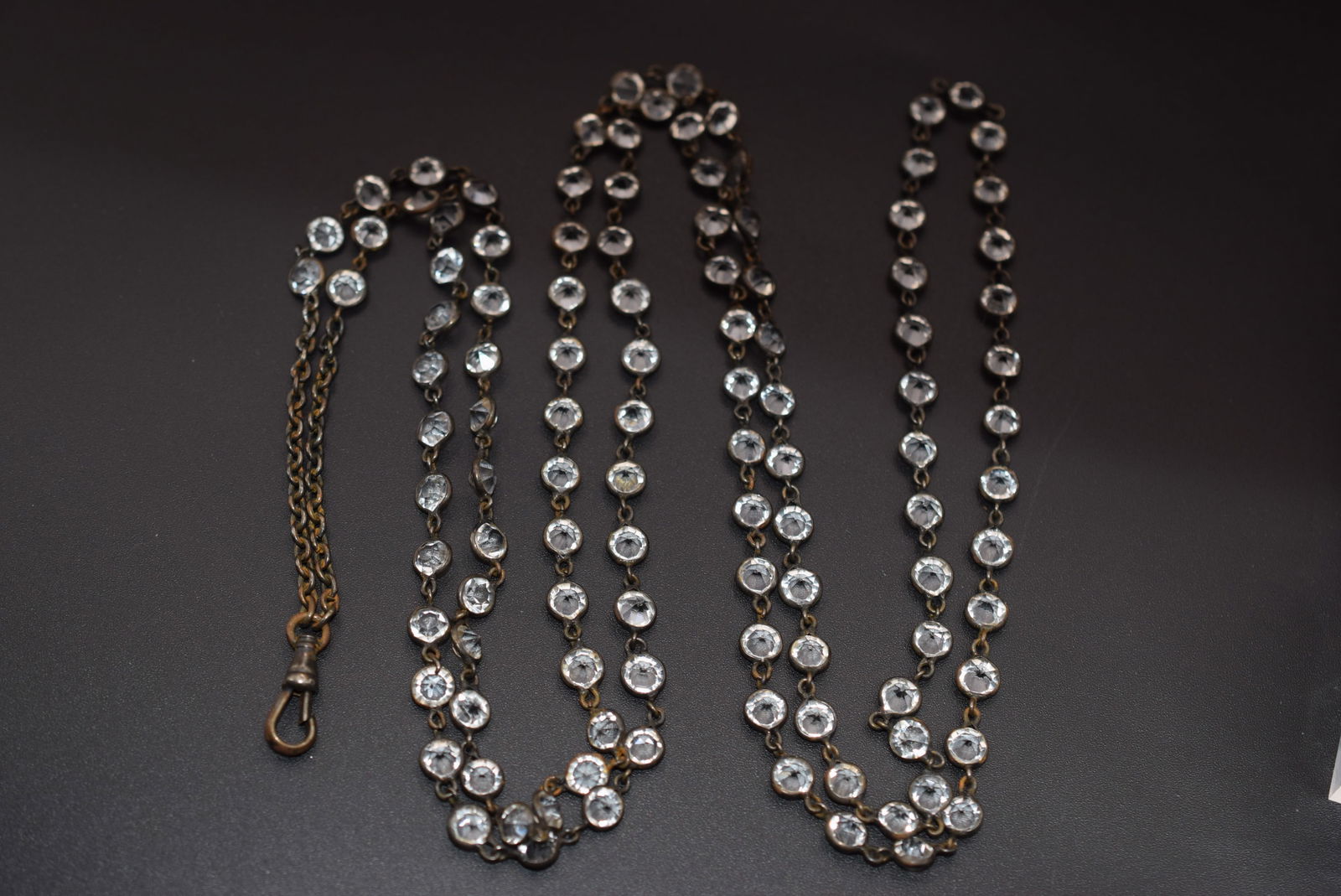 Edwardian Invisible Set 44" long Crystal Watch Fob Chain Vintage Lot 1114: Edwardian Invisible Set 44" long Crystal Watch Fob Chain Vintage measures 43" long for Crystals and the chain drop measures 4" plus Fob hook 3/4" has som wear to the metal see pics it is a gorgeous pi