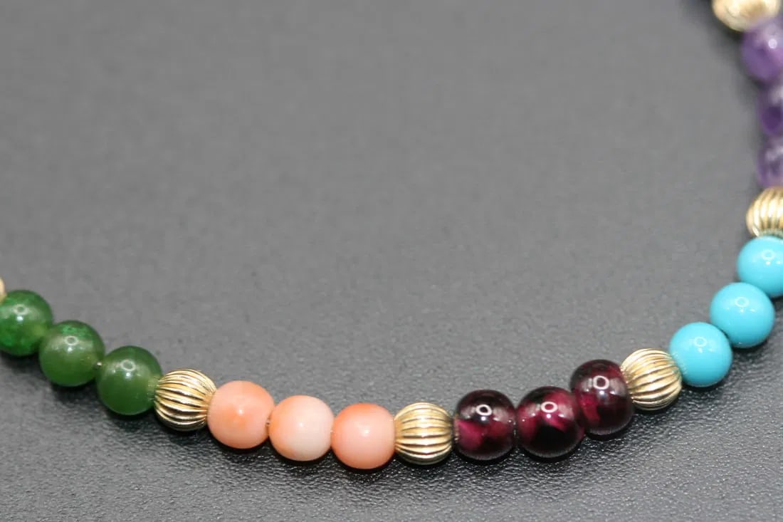 Gemstone Garnet Coral Jade Turquoise Onyx Tiger eye Goldstone all Healing Bracelet .lot#235: Gemstone Garnet Coral Jade Turquoise Onyx Tiger eye Goldstone All Healing Stones in one bracelet! Bracelet measures 7.5" long and the beads measure 4mm the clasp is signed gold filled 12K
