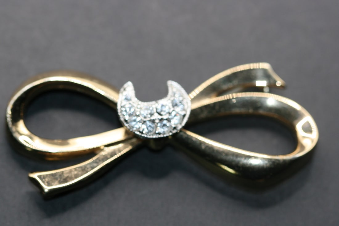 Pegasus Coro Bow Brooch Rhinestone Vintage Lot 705: Pegasus Coro Bow Brooch Rhinestone Vintage measures 2 5/8" x 1 1/4" signed on the back Coro with Pegasus logo