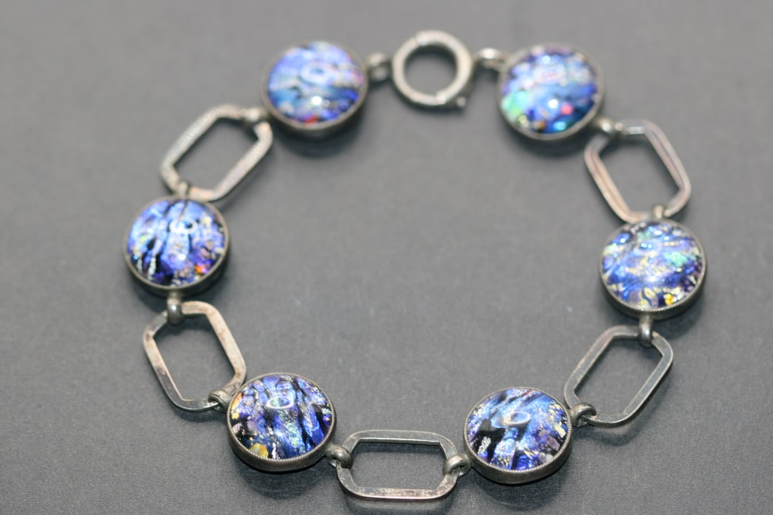 Butterfly wing Sterling Silver 925 Bracelet Glass England 1950'S signed Lot 784: Sterling Silver 925 Refelctive Blue Foiled Stones and Sterling looks like butterfly wing Bracelet Glass England 1950'S signed JLM Sterling England on the back and measures 7 3/4" long x 5/8" wide