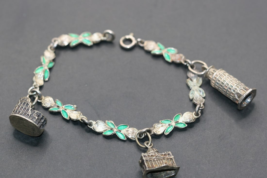 Charm Bracelet Vatican Sterling Silver 800 Enamel Vintage Lot 829: Charm Bracelet Vatican Pisa and Colluseum Sterling Silver 800 Enamel Vintage measures 7 3/8" x 1/4" signed 800 silver on one charm and on the bracelet clasp weighs 19 grams