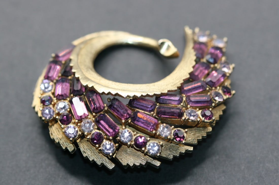 Coro Pegasus Vintage Amethyst Rhinestone Brooch Pin Lot 869: Coro Pegasus Vintage Amethyst Rhinestone Brooch Pin measures 2 3/8" x 2" signed on the back Coro with pegasus logo