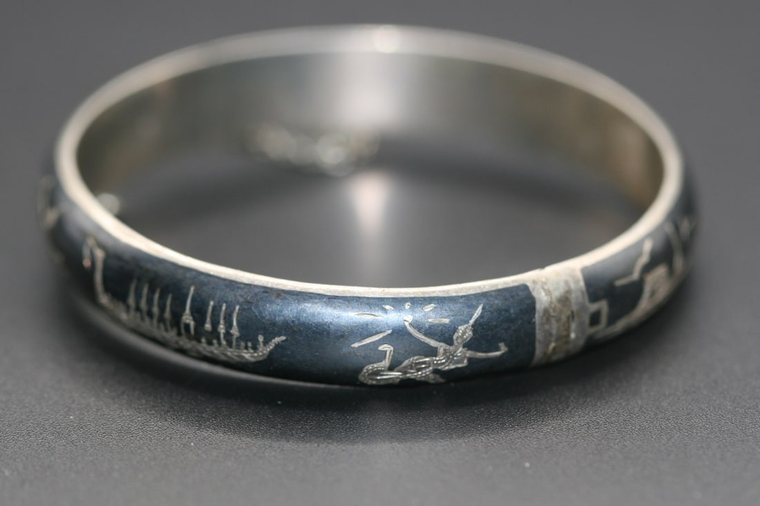 Siam Sterling Niello Story Bracelet Vintage Sterling Silver 925 .Lot#120: Siam Sterling Niello Story Bracelet Vintage Sterling Silver 925 measures 2 3/8" inside across and is signed on the inside Siam Sterling width measures 3/8"