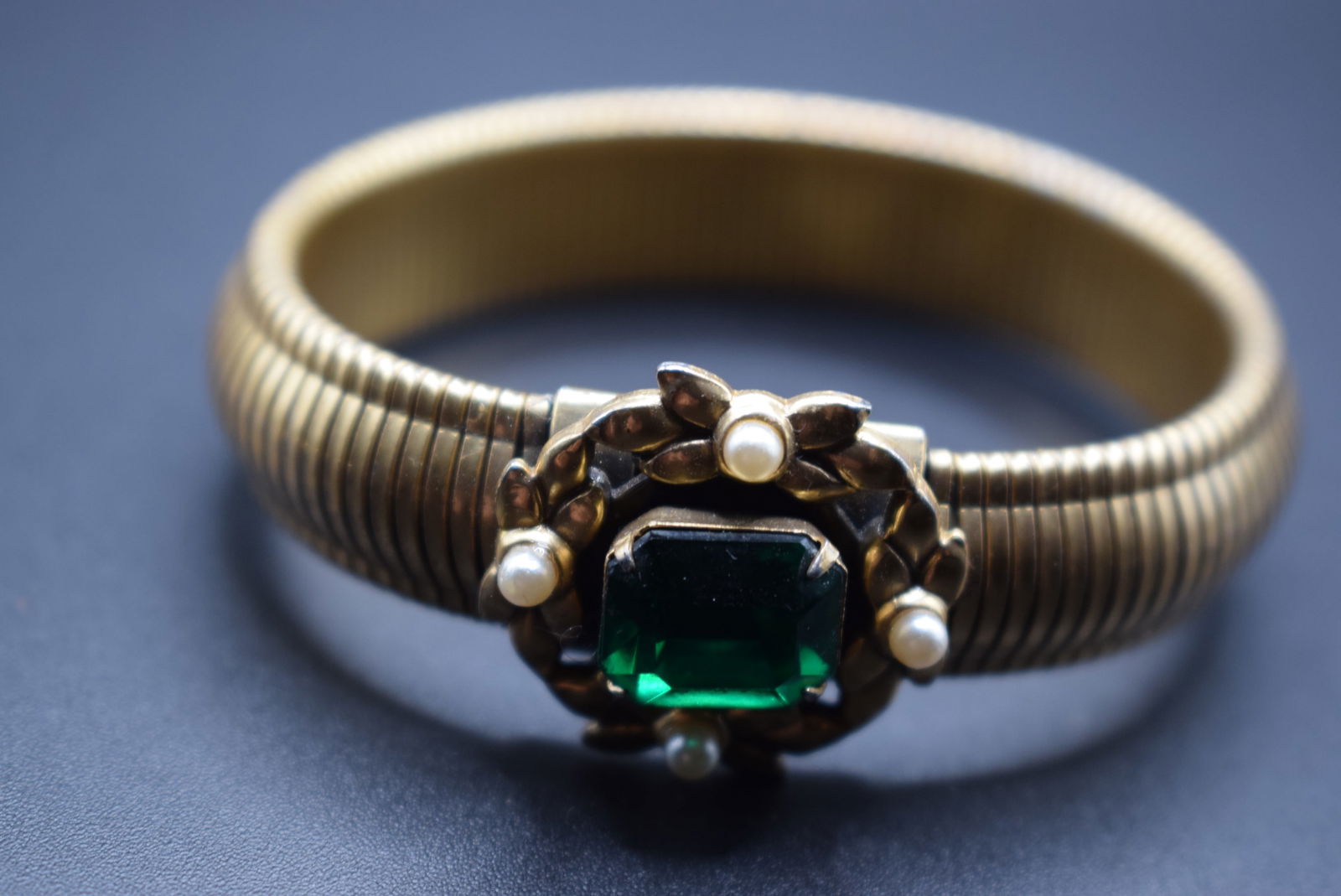 Coro green stretch expandable bracelet Green Rhinestone signed .Lot#154: Coro green stretch expandable bracelet Green Rhinestone signed center measures 1" wide band 1/2" wide unstretched inside 2 1/4" signed Coro inside with a pegasus with some wear to the inside where the