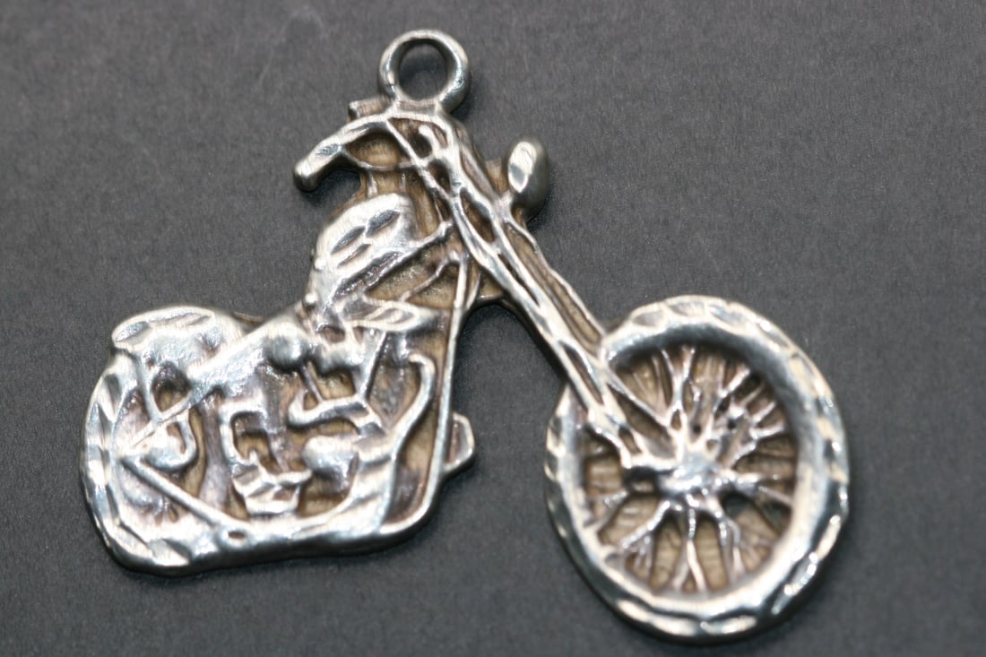 Harley Motorcycle Bike Sterling Silver 925 Pendant heavy thick vintage .Lot#310: Harley Motorcycle Bike Sterling Silver 925 Pendant heavy thick vintage measures 1 7/8" x 1 1/2" stamped 925 on the back weighs 12 grams