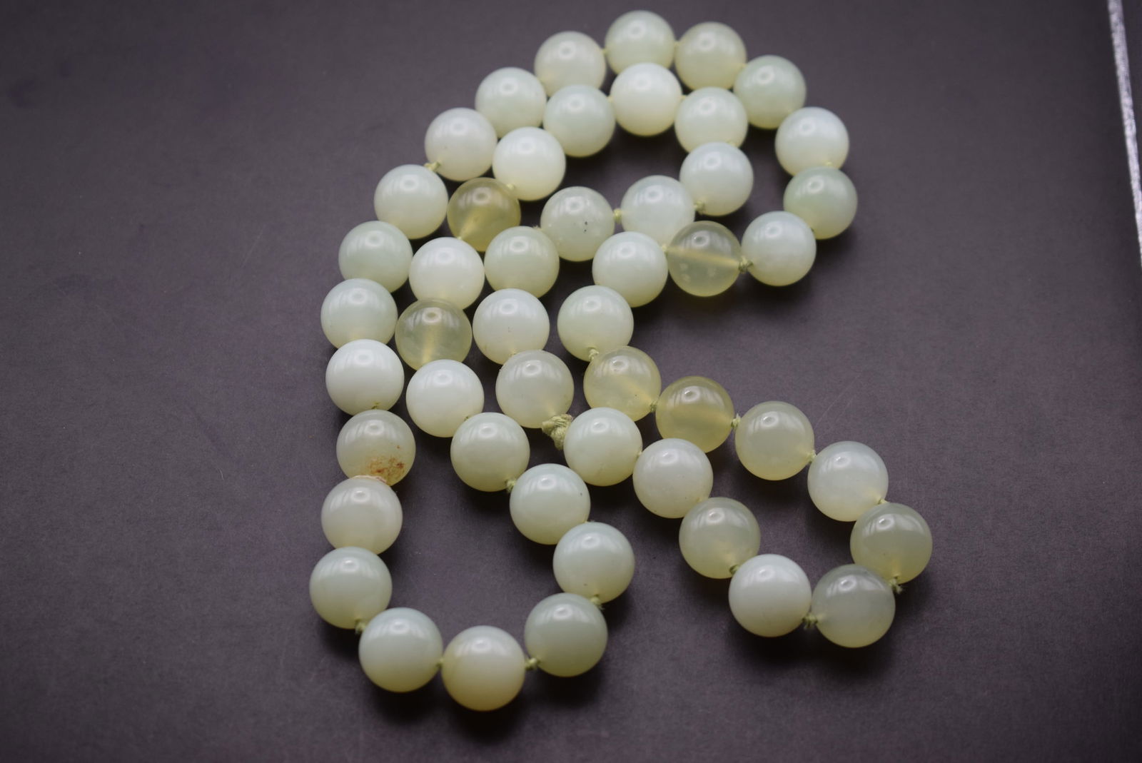 Jade knotted huge bead necklace vintage Lot 344: Jade knotted huge bead necklace vintage beads measure 14mm and it is 29" long all knotted no clasp