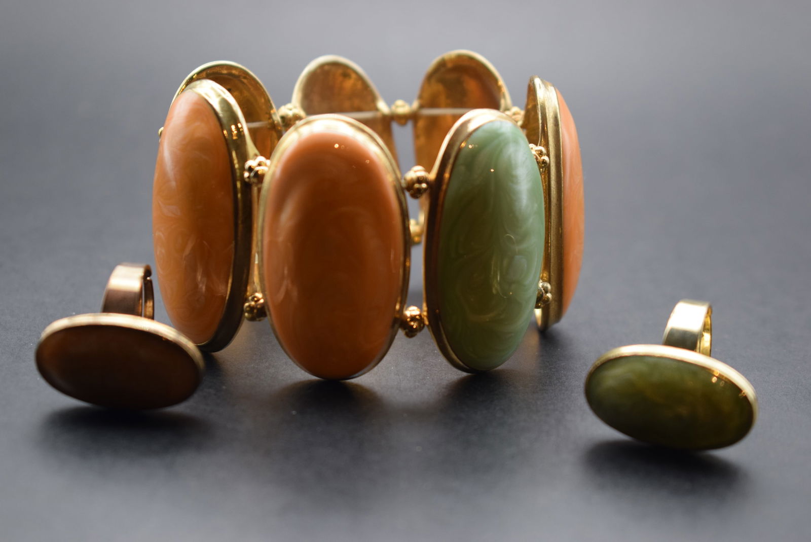 Crazy Bracelet and 2 matching rings Lot 377: Crazy Bracelet and 2 matching rings ! Huge Peach and mint bracelet enameled measures 1 3/4" wide and the two rings are one peach one mint each are one size adjustable smalest size 8