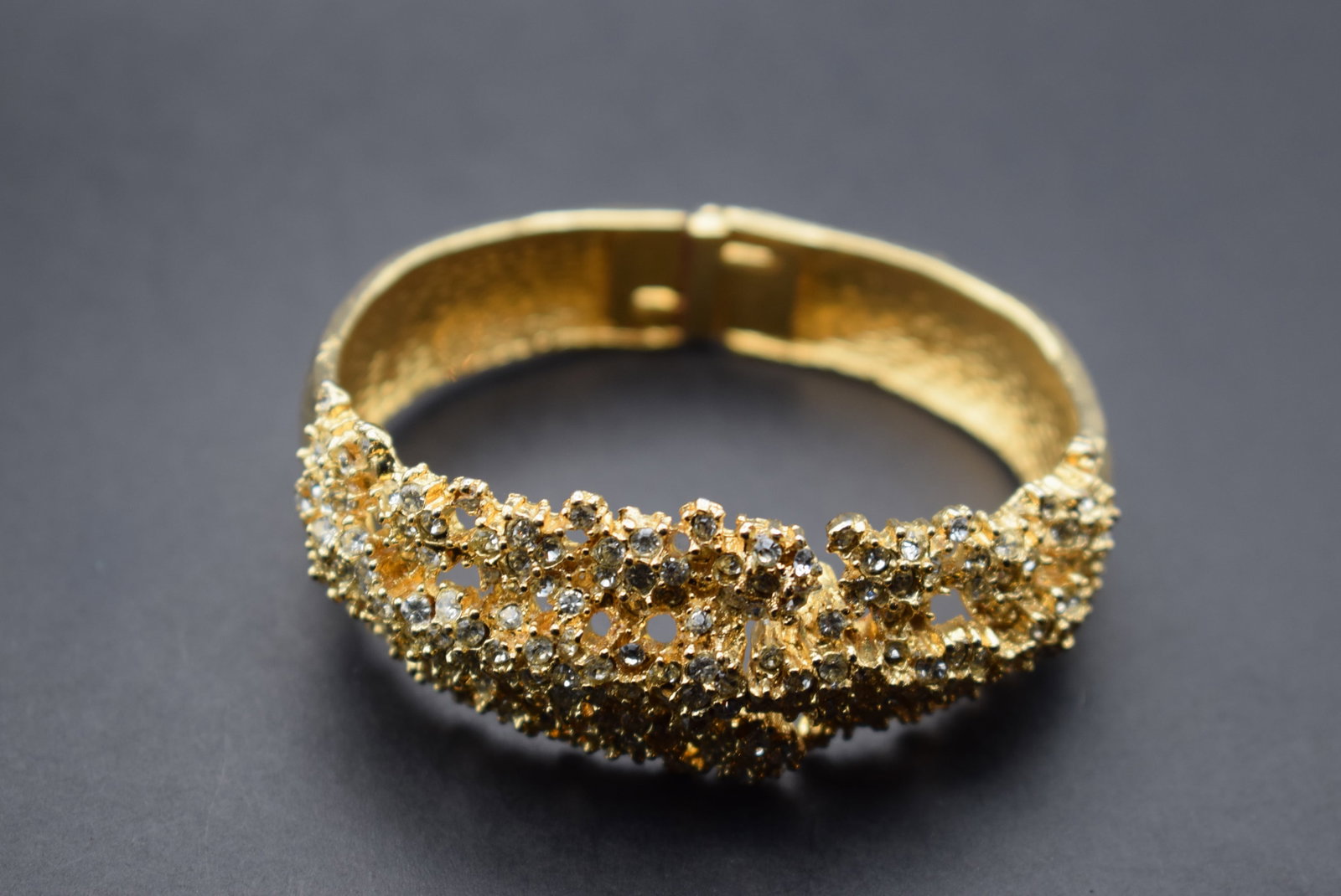 Rhinestone 1950's Clamper Bracelet Lot 378: Rhinestone 1950's Clamper Bracelet measures 1 1/8" wide and is hinged so opens easily inside measures 2 3/8" across