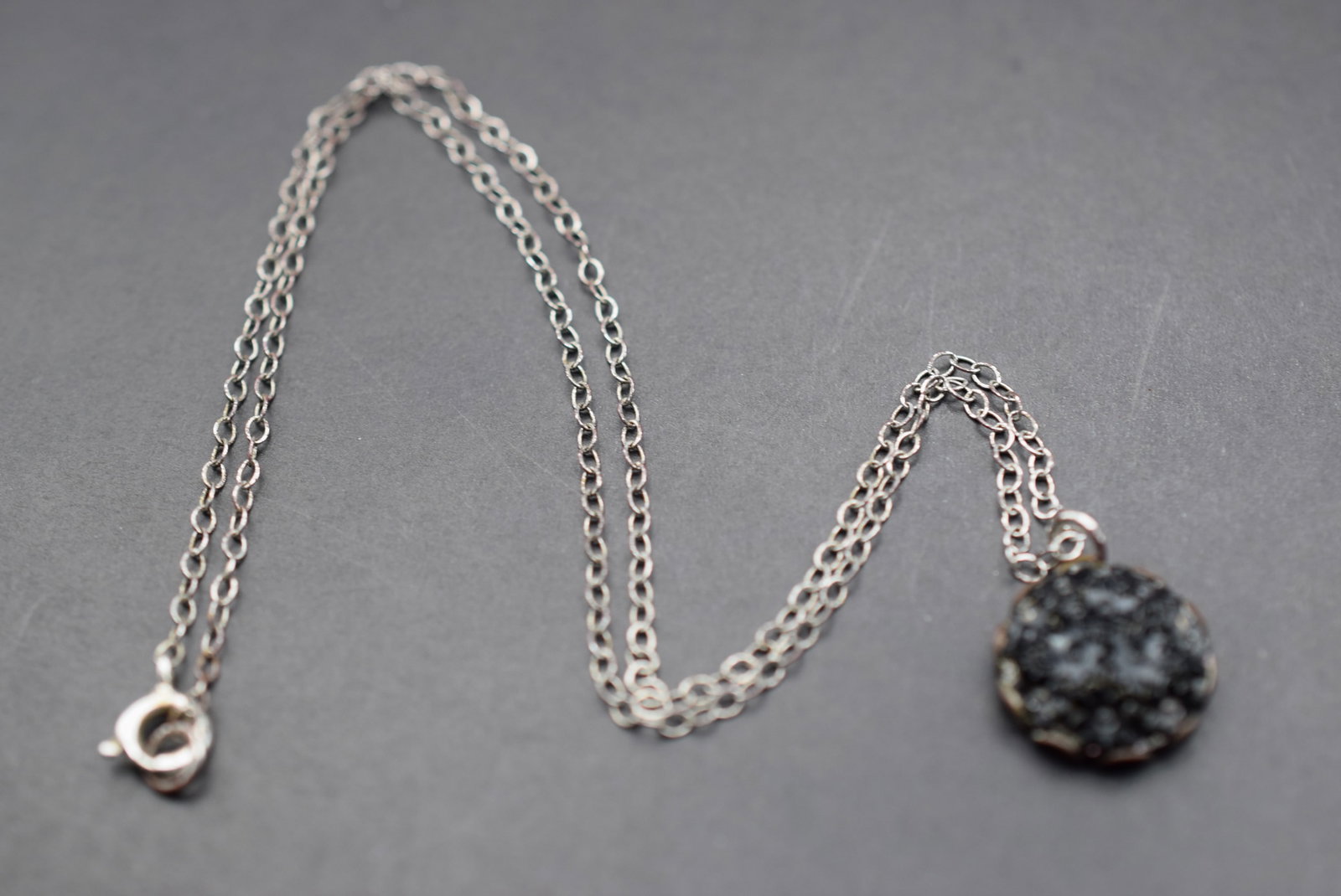 Necklace 1930's glass pendant flowers fine chain Lot 528: Necklace 1930's glass pendant flowers fine chain but not sterling pendant measures 1/2" in diameter and chain is 15" Long
