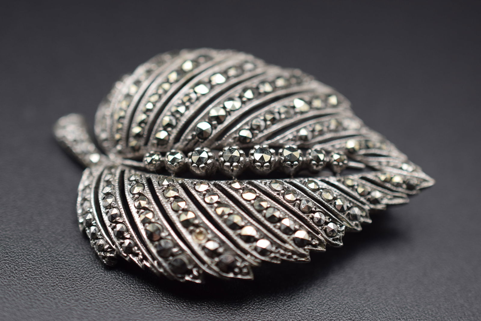 European Silver 800 Marcasite Vintage Brooch Pin Lot 113: European Silver 800 Marcasite Vintage Brooch Pin measures 1 7/8" x 1 1/4" signed on the back 800 and a logo weighs 13.30 grams
