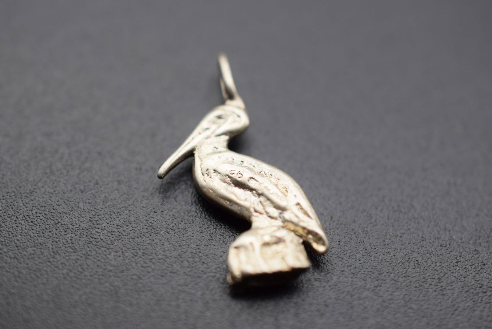 Sterling Silver 925 Pelican Pendant Charm Lot 145: Sterling Silver 925 Pelican Pendant Charm measures 1" x 1/2" signed 925 on the wing weighs 1.95 grams