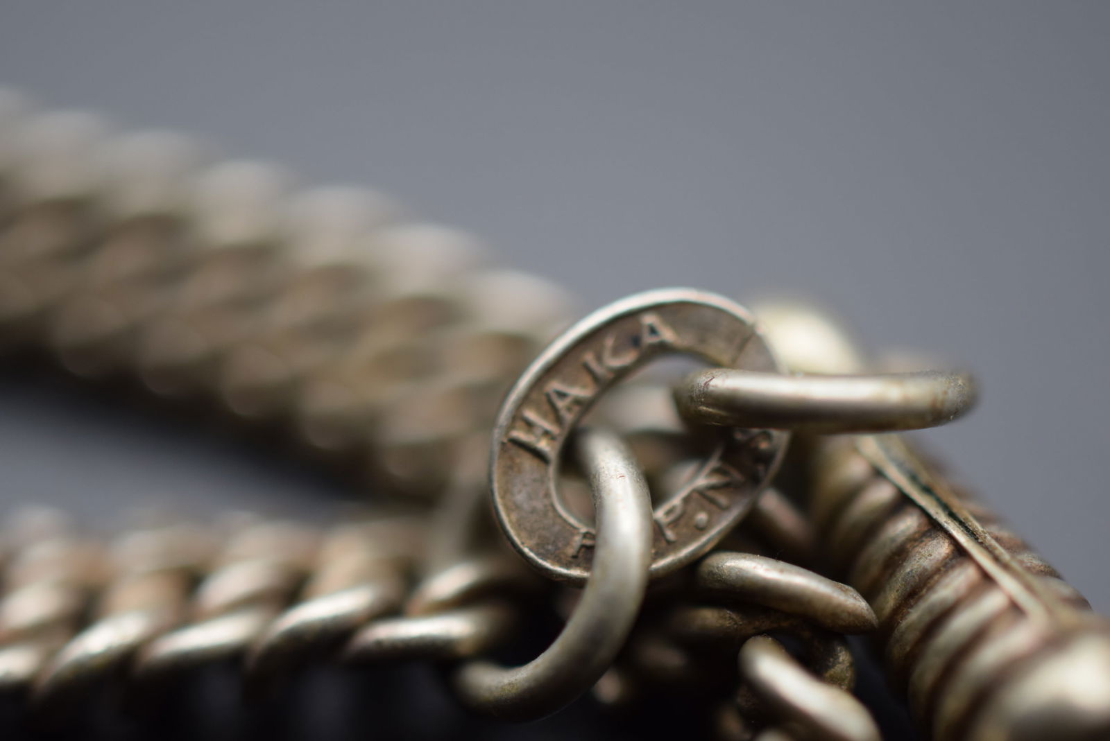 Edwardian FOB Watch Chain Vintage Lot 601: Edwardian FOB Watch Chain Vintage measures 9 3/4" long signed HAKA A.L.P.N.S.