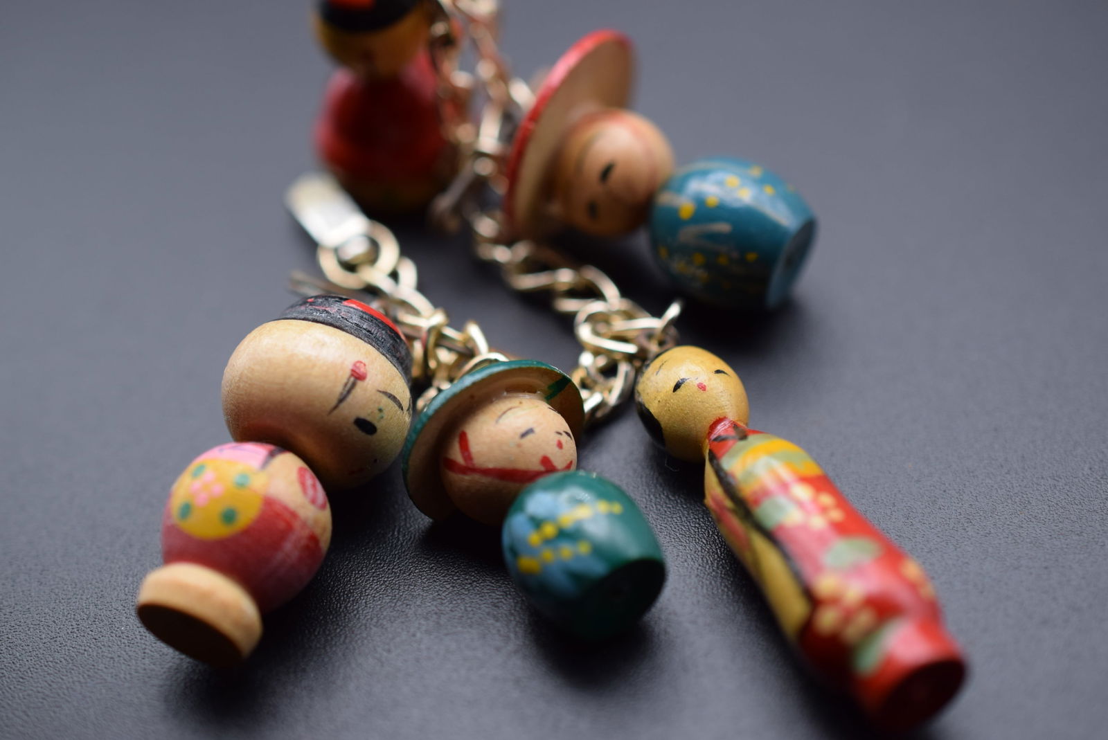 Wooden Charm Chinese Persons Charm Bracelet 1970's Vintage Lot 625: Wooden Charm Chinese Persons Charm Bracelet 1970's Vintage measures 6 1/2" long charms are from 1" to 1 1/2" tall