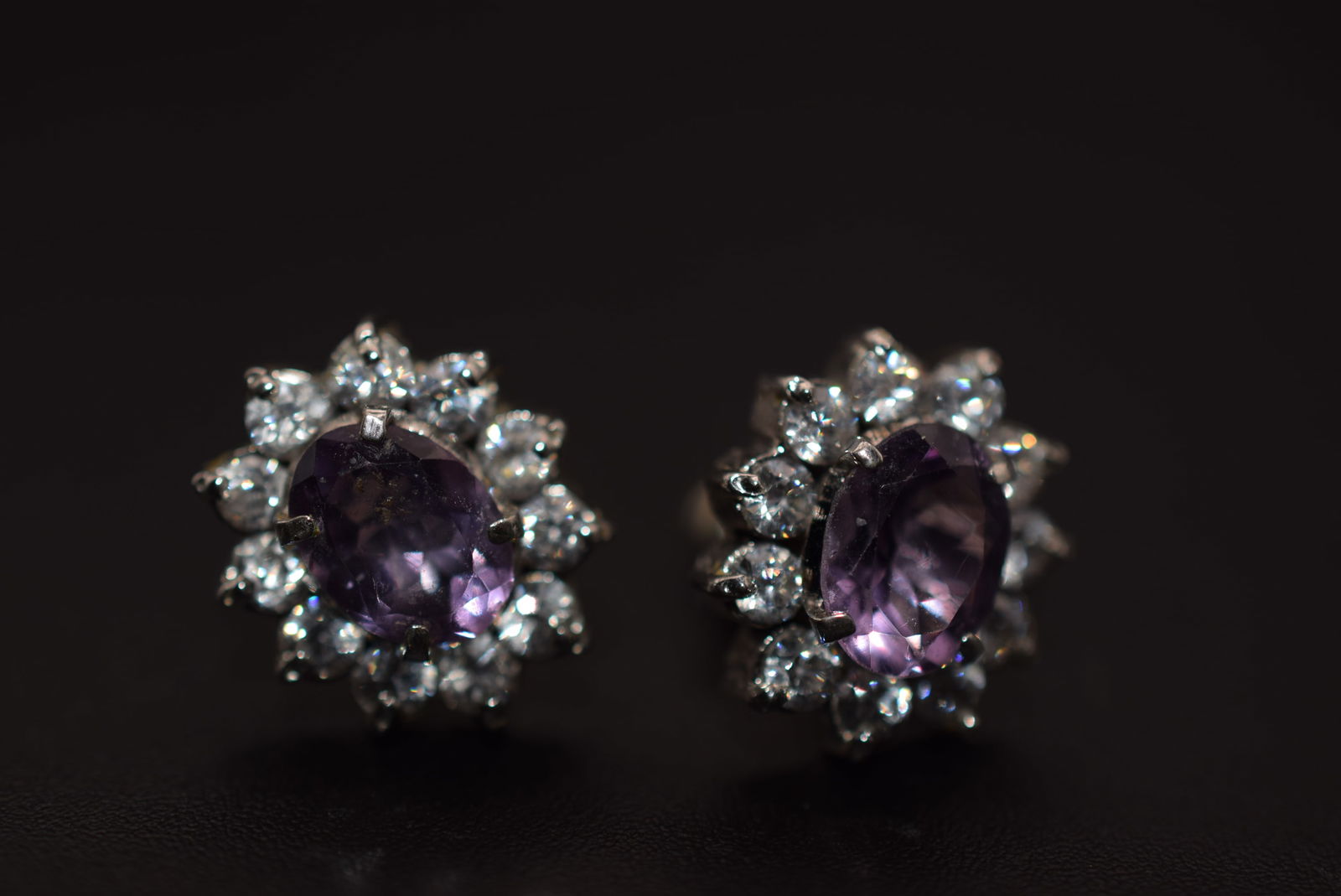 CZ Light Amethyst Pierced Earrings Lot 661: CZ Light Amethyst Pierced Earrings measures 5/8" x 1/2"
