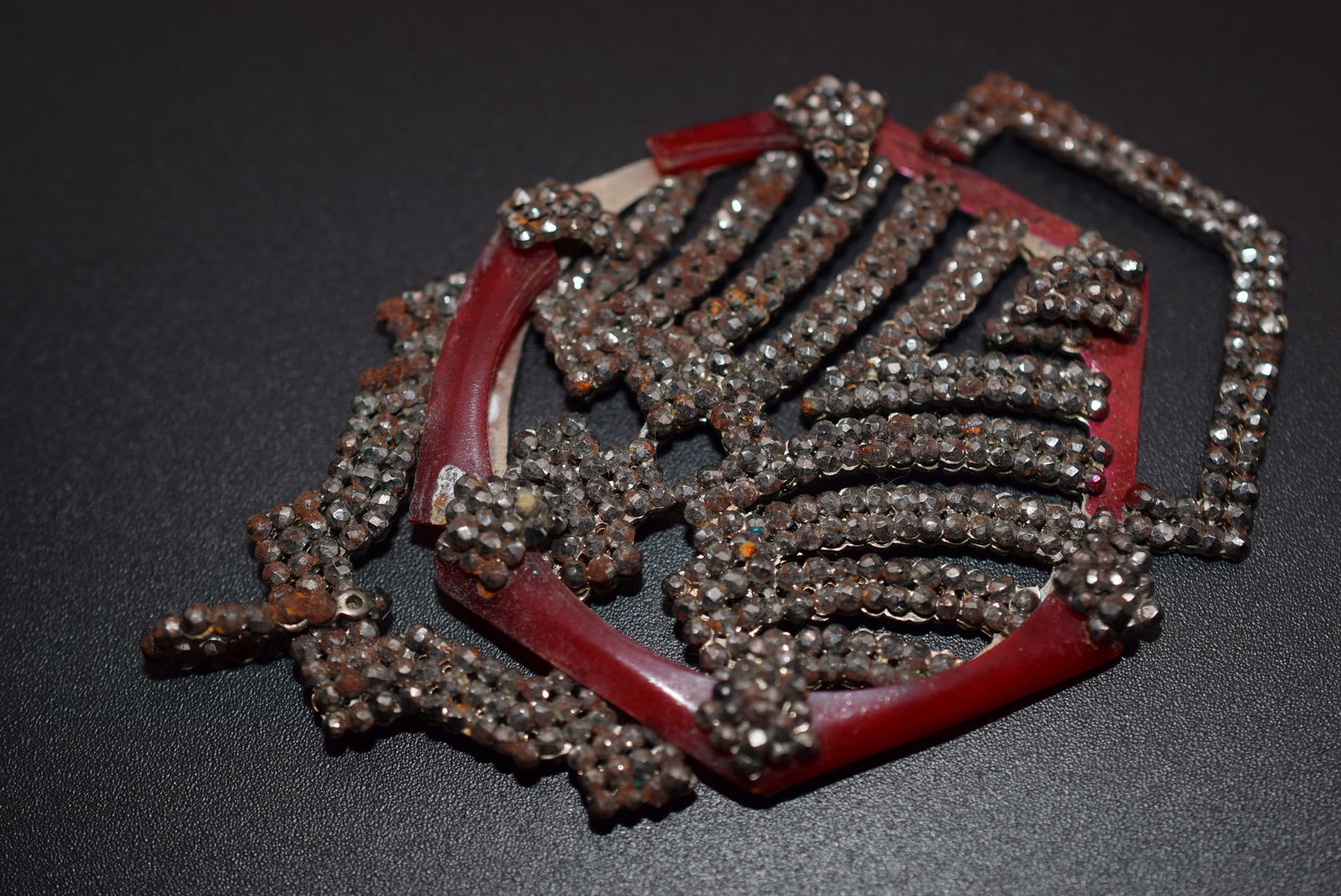 France Art Deco Pendant Vintage 1920's Cut Steel Lot 776: France Art Deco Pendant Vintage 1920's Cut Steel measures 3 1/2" x 2" has rust needs cleaning carefully one burgundy piece is broken off signed Made in France