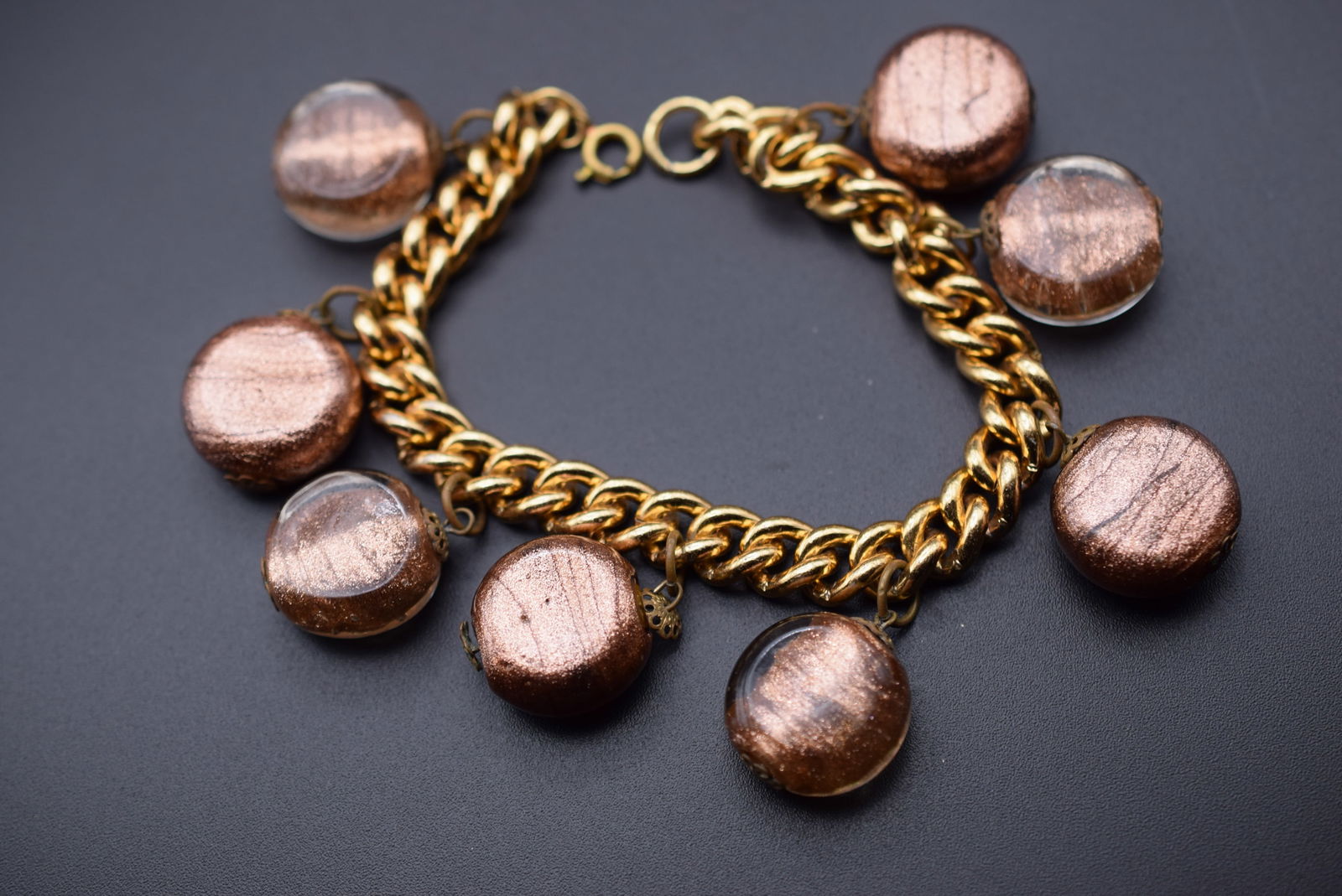 Copperstone Dangle Eclectic Bracelet Lot 787: Copperstone Dangle Eclectic Bracelet measures 8" long the murano Glass beads measure 18mm