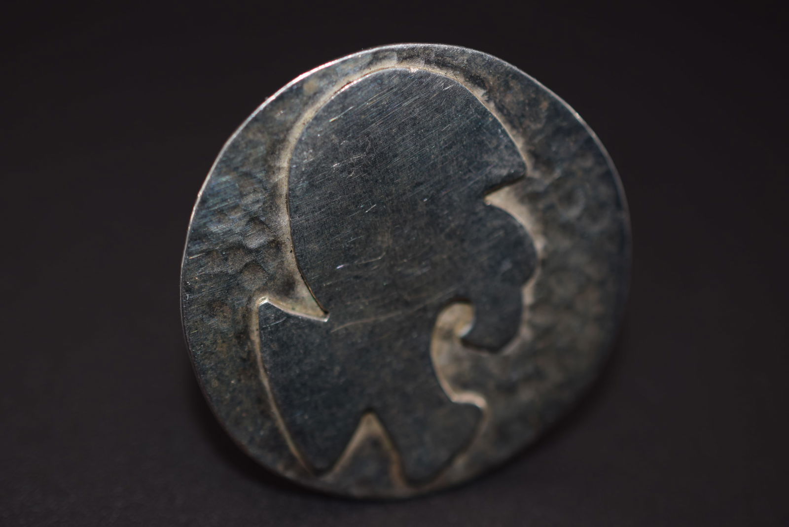 Modernist Scandanavian Ring Size 6 Hammered Top Lot 970: Modernist Scandanavian Ring Size 6 Hammered Top measures 1 1/4" in diameter Weighs 10 grams